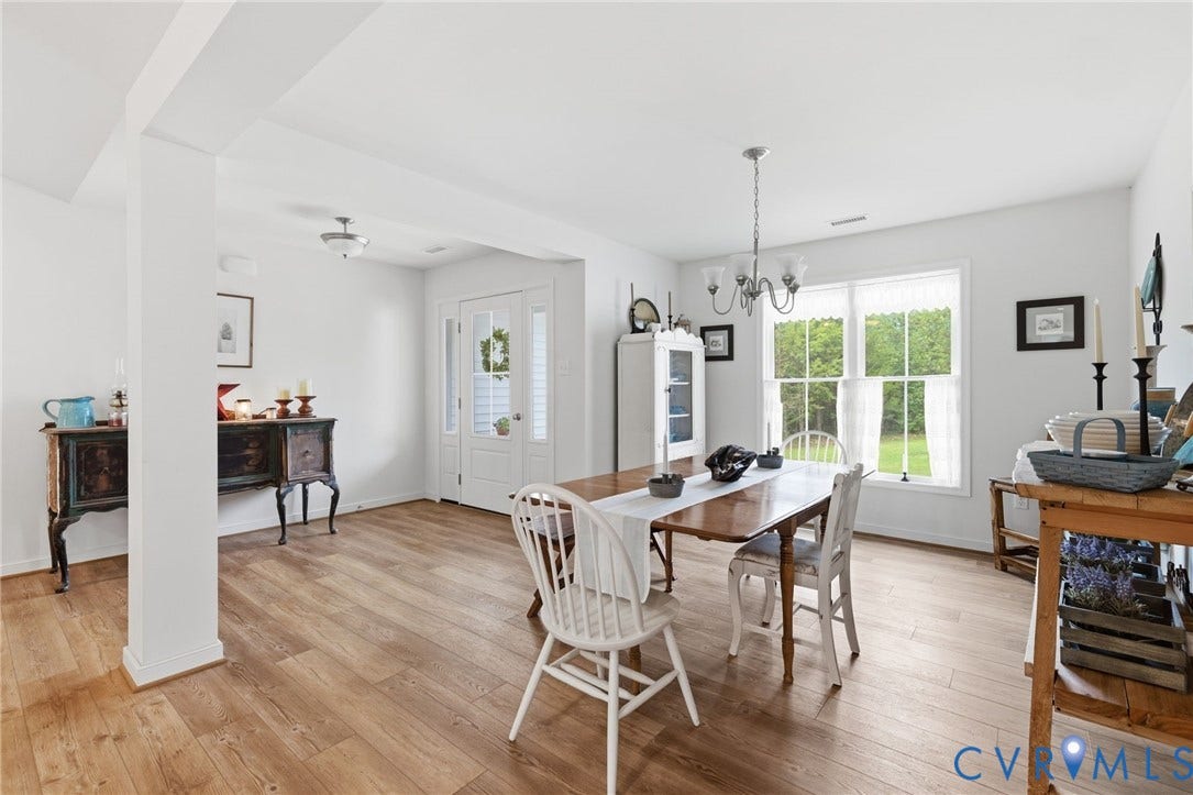 2927 Poorhouse Road, 522 Corridor, Goochland, VA 23063 LVP flooring throughout, white walls, double-pane windows, and a glass-paneled entry door with sidelights