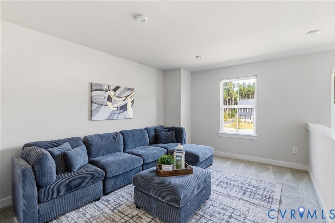 8618 McKibben Drive, The Highlands, Chesterfield, VA 23838 Carpeted room with a single window, recessed lighting, and a partial wall with a white railing