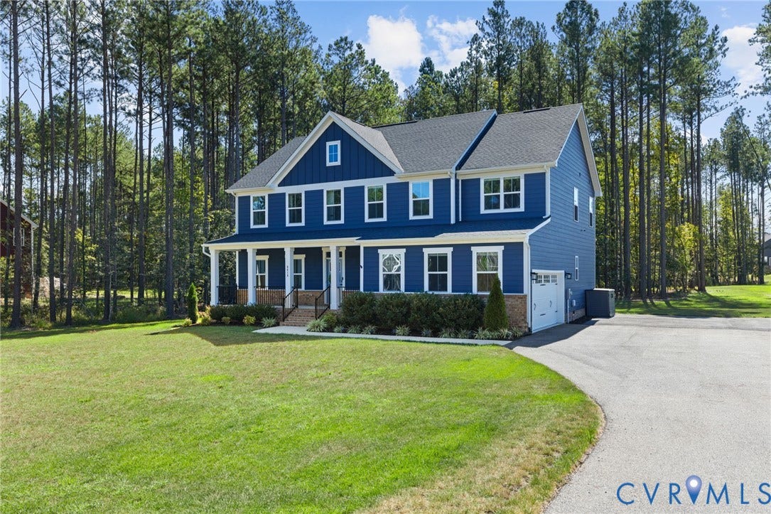 8618 McKibben Drive, The Highlands, Chesterfield, VA 23838 Two-story residence featuring blue siding, white trim, and a covered front porch with white columns