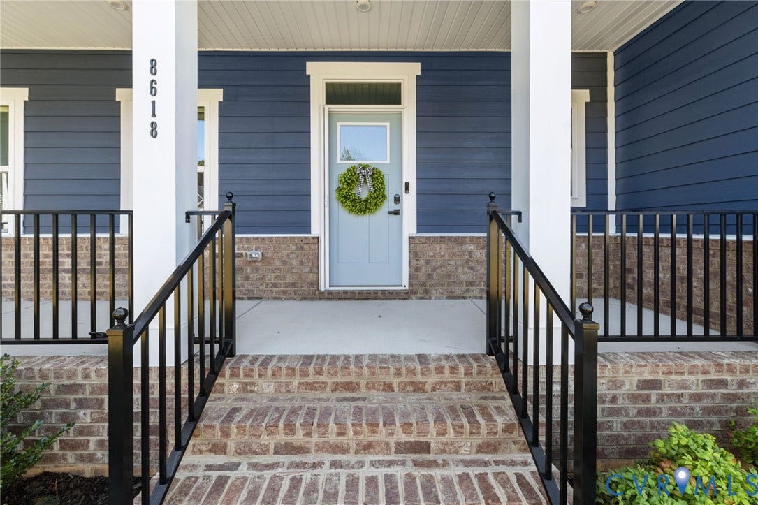 8618 McKibben Drive, The Highlands, Chesterfield, VA 23838 Front porch featuring brick stairs, black metal railings, and a blue siding exterior