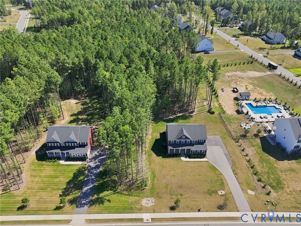8618 McKibben Drive, The Highlands, Chesterfield, VA 23838 Two-story residences with dark roofs and light siding, surrounded by mature trees and landscaped green spaces