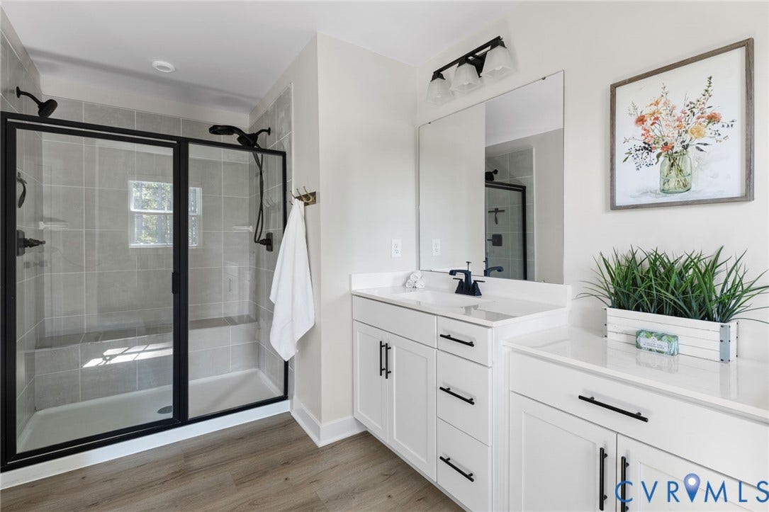 8618 McKibben Drive, The Highlands, Chesterfield, VA 23838 Glass-enclosed shower with a tiled surround and built-in bench