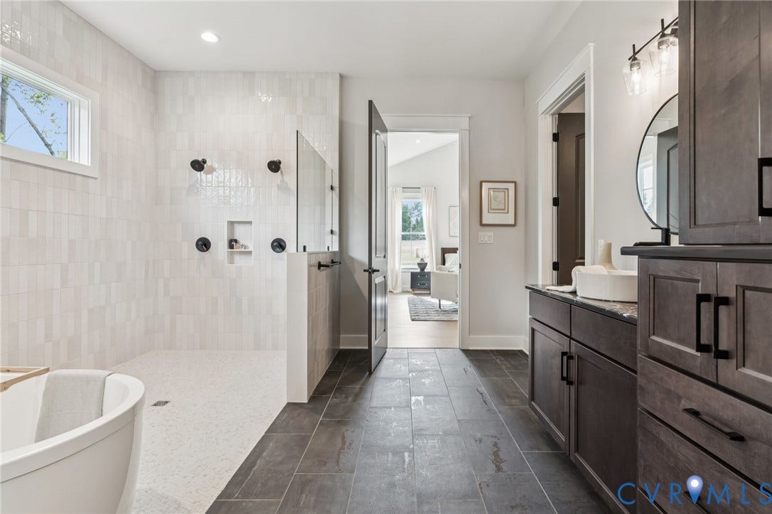 Lot 2 Needlewood Court, Olivet Church Estates, New Kent, VA 23124 Spacious bathroom featuring a freestanding tub, walk-in shower with dual shower heads, and an extended vanity with dual sinks