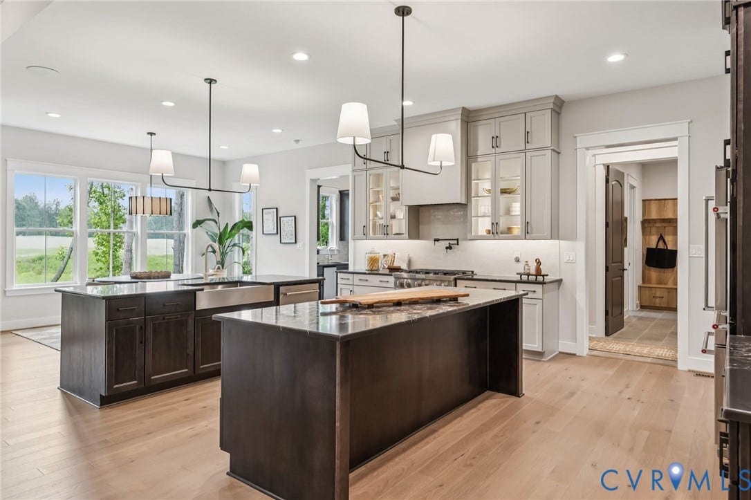 Lot 2 Needlewood Court, Olivet Church Estates, New Kent, VA 23124 Kitchen featuring two islands, light wood-finish flooring, recessed lighting, and large windows