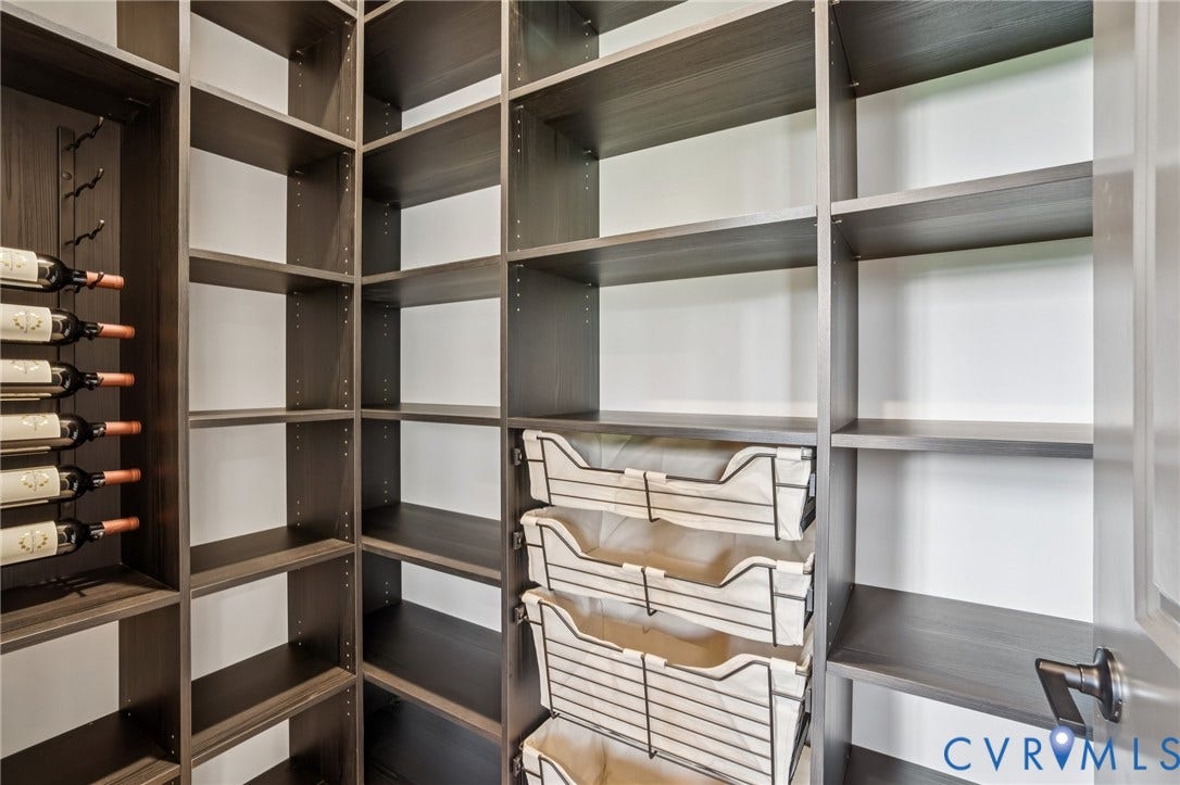 Lot 2 Needlewood Court, Olivet Church Estates, New Kent, VA 23124 Built-in shelving with a dark wood-finish, integrated wine storage, and pull-out wire baskets