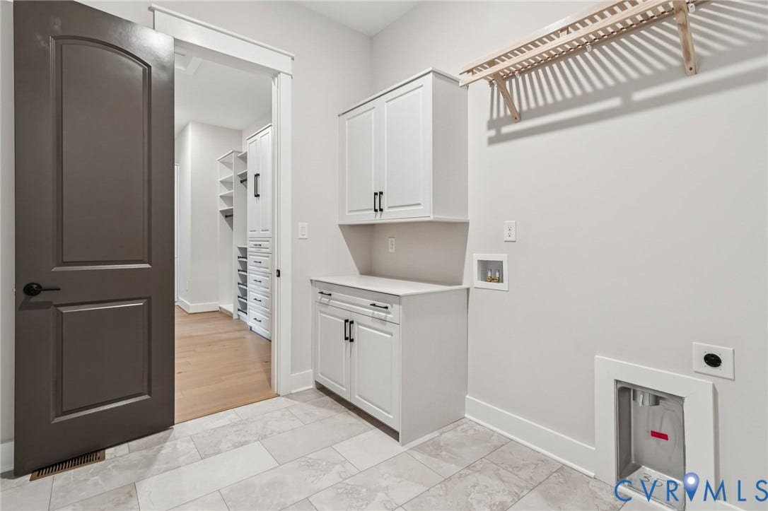 Lot 2 Needlewood Court, Olivet Church Estates, New Kent, VA 23124 Tiled flooring, white cabinetry with black hardware, white countertop, and a wooden drying rack