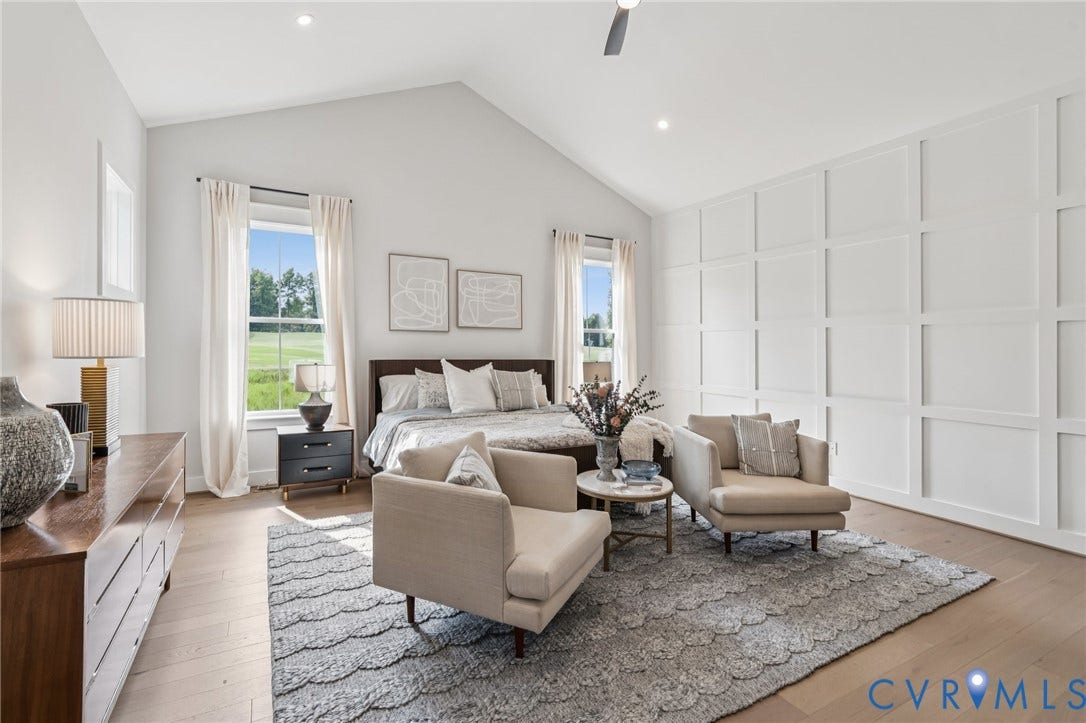 Lot 2 Needlewood Court, Olivet Church Estates, New Kent, VA 23124 Vaulted ceiling with recessed lighting, light wood-finish flooring, accent wall with panel detailing, and two windows with outdoor scenery