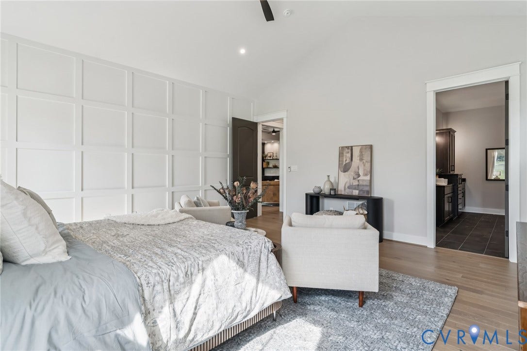 Lot 2 Needlewood Court, Olivet Church Estates, New Kent, VA 23124 Vaulted ceilings, wood-finish flooring, accent wall with panel molding, recessed lighting, and a dark wood-paneled door
