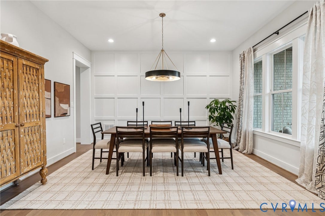 Lot 2 Needlewood Court, Olivet Church Estates, New Kent, VA 23124 Recessed lighting, wood-finish flooring, accent wall paneling, large window with white trim, and a prominent chandelier