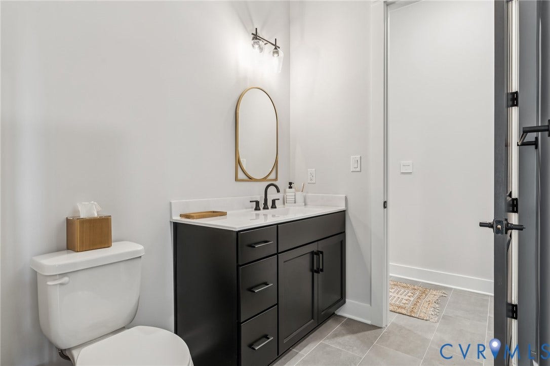 Lot 2 Needlewood Court, Olivet Church Estates, New Kent, VA 23124 Integrated vanity with black cabinetry, white countertop, and a black-finish faucet