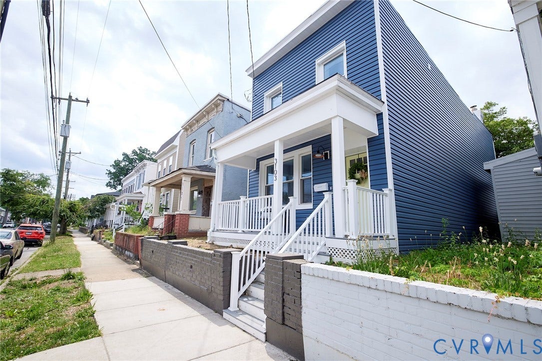 3103 Q St, Church Hill, Richmond, VA 23223 Blue siding exterior with white trim, covered front porch, white railing, and exterior staircase