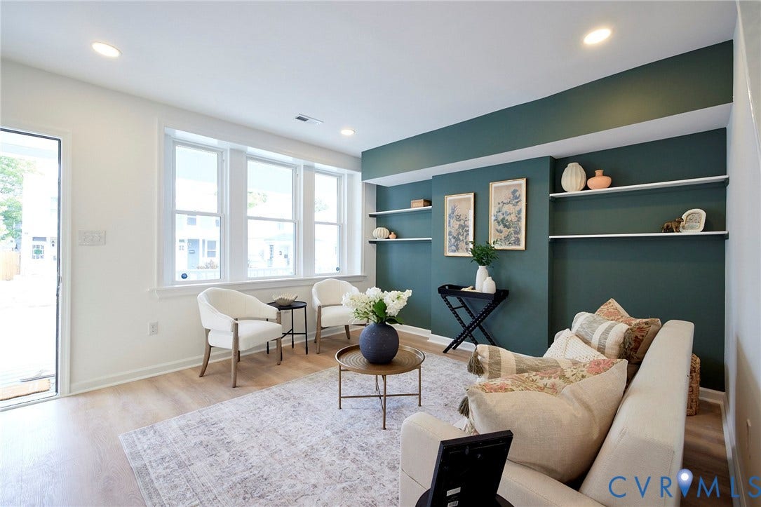 3103 Q St, Church Hill, Richmond, VA 23223 Recessed lighting, wood-finish flooring, multiple windows, built-in shelving, and a prominent accent wall