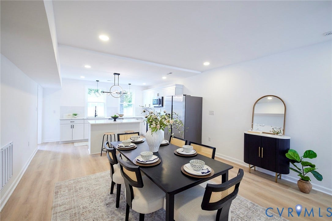 3103 Q St, Church Hill, Richmond, VA 23223 Open-concept living space with wood-finish flooring, recessed lighting, and a white kitchen with an island