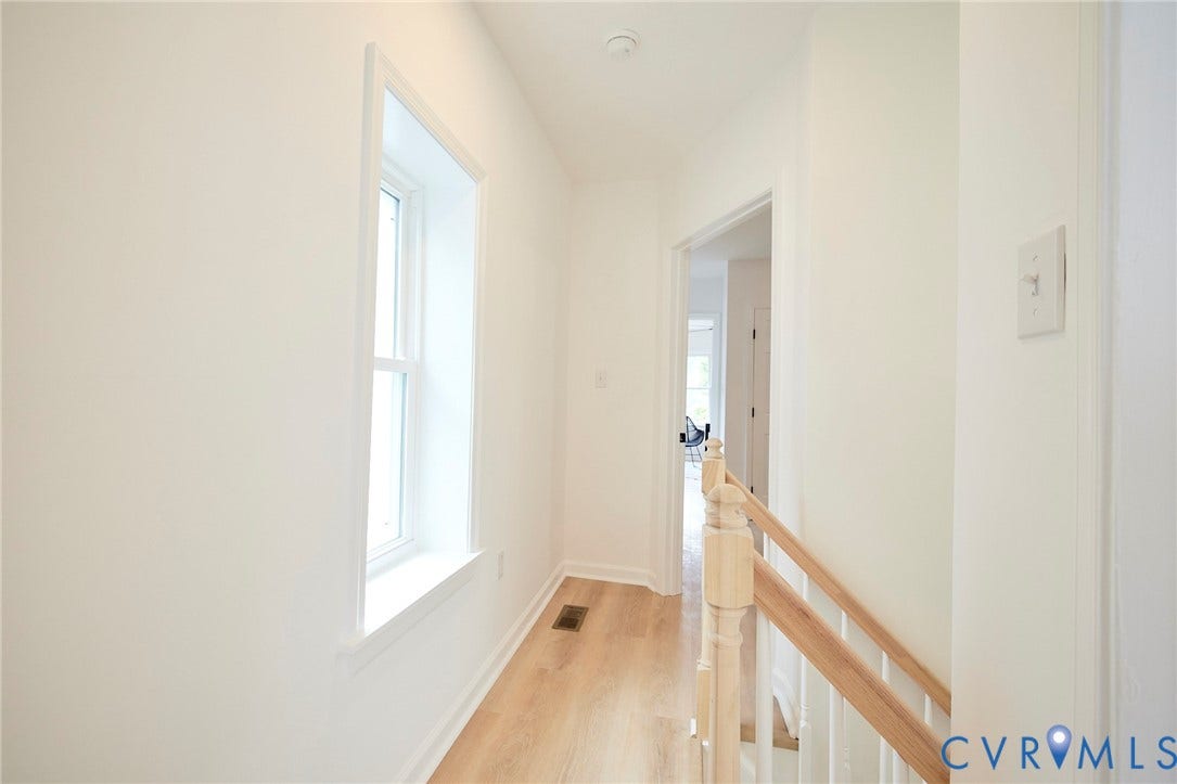 3103 Q St, Church Hill, Richmond, VA 23223 Light wood-finish flooring, white walls, and a window with white trim