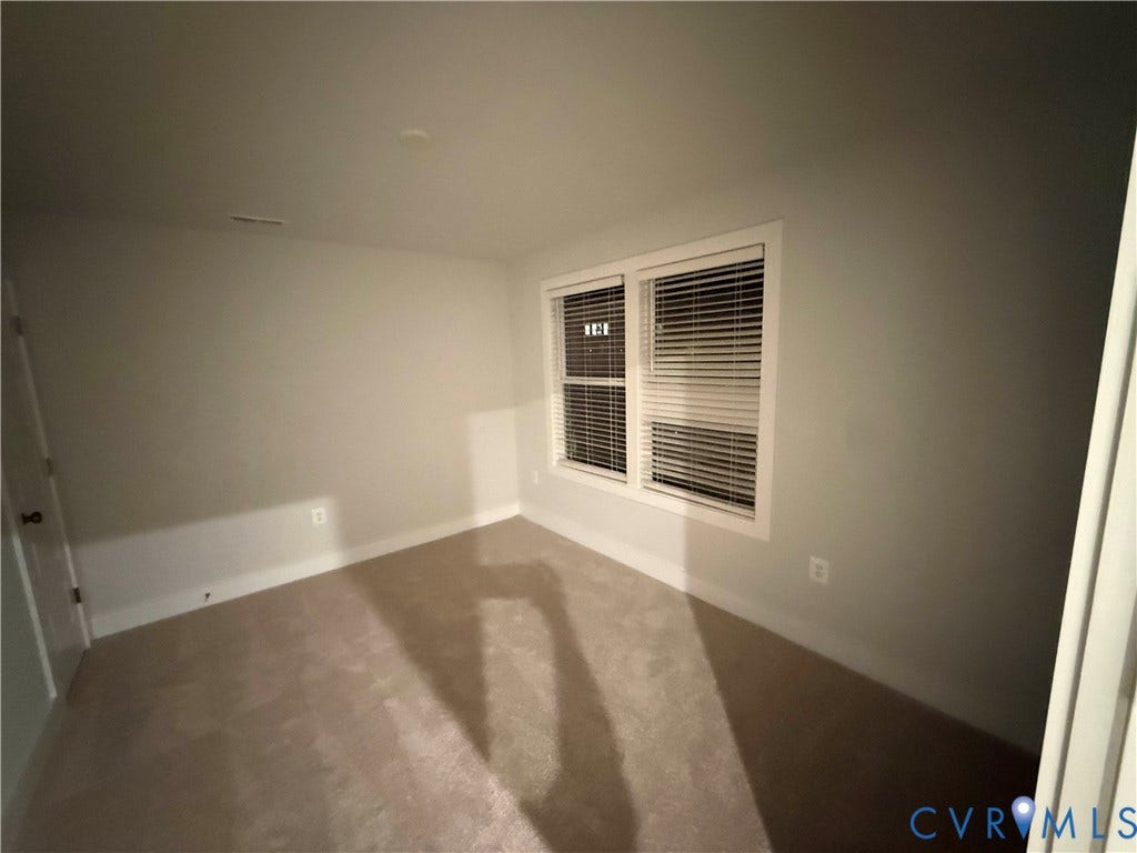 9452 belladdie Way, Glen Allen, VA 23059 Wall-to-wall carpeting with neutral wall tones, white trim, and a window with blinds