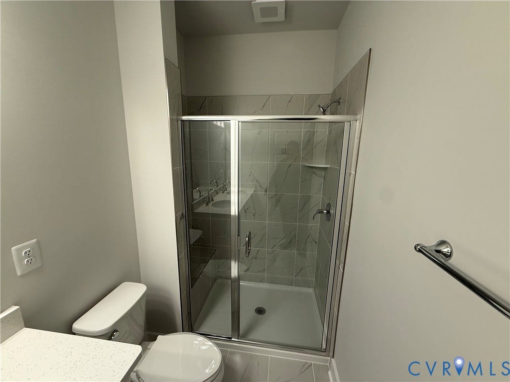 9452 belladdie Way, Glen Allen, VA 23059 Glass-enclosed shower with a tiled surround