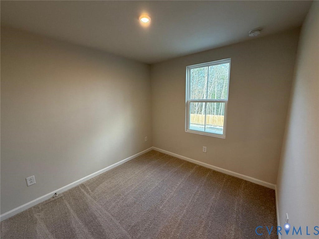 5409 Canterbury Ridge Way, Richmond, VA 23224 Neutral wall paint, recessed ceiling lighting, a single window, and carpeted flooring