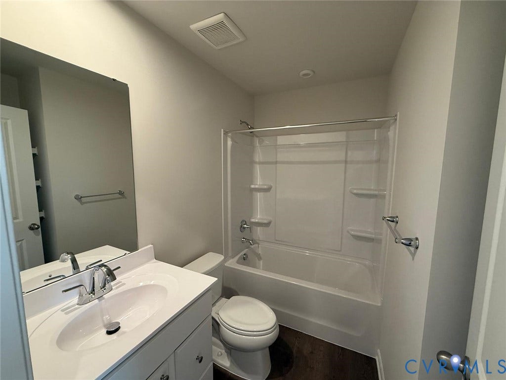 5409 Canterbury Ridge Way, Richmond, VA 23224 Vanity with integrated sink, chrome faucet, and storage cabinetry