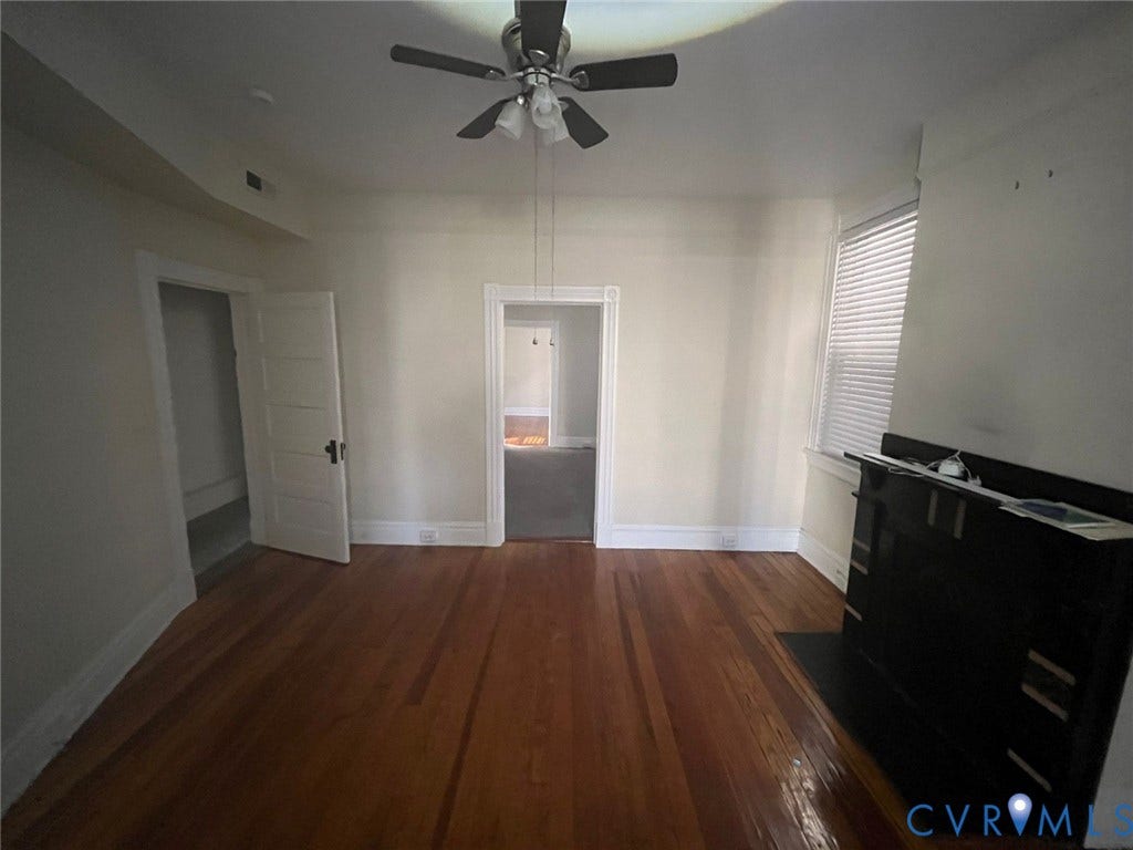 419 N 26th Street, #A, Richmond, VA 23223 Hardwood flooring throughout, ceiling fan with integrated lighting, built-in fireplace surround, and window with blinds