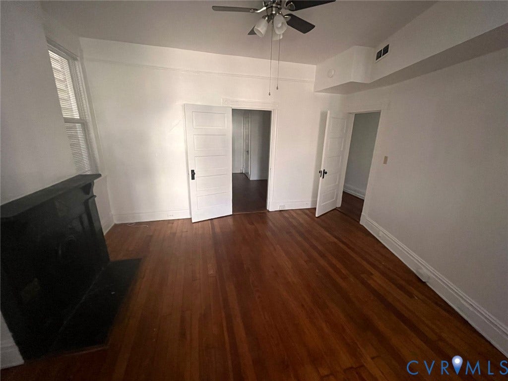 419 N 26th Street, #A, Richmond, VA 23223 Hardwood flooring, ceiling fan, white paneled doors, built-in black fireplace