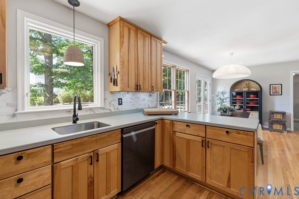 2416 Mountainbrook Drive, Crown Grant, Henrico, VA 23233 Kitchen featuring wood cabinetry, light Corian countertops, a stainless steel sink with a black faucet, and a stainless steel dishwasher