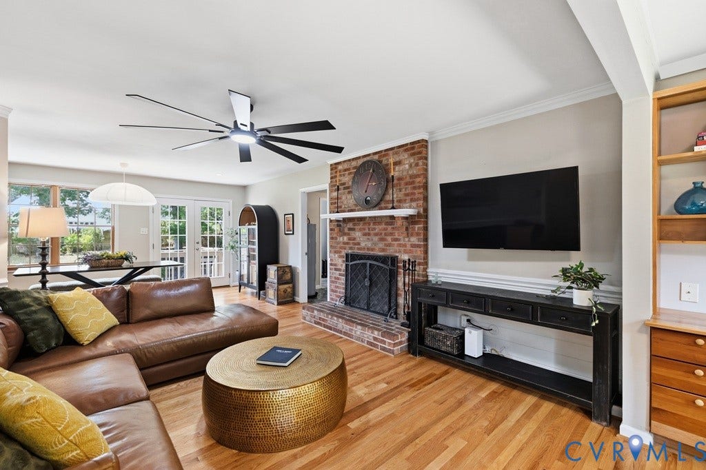 2416 Mountainbrook Drive, Crown Grant, Henrico, VA 23233 Hardwood flooring throughout, brick fireplace with mantel, French doors, lighting, and a multi-blade ceiling fan