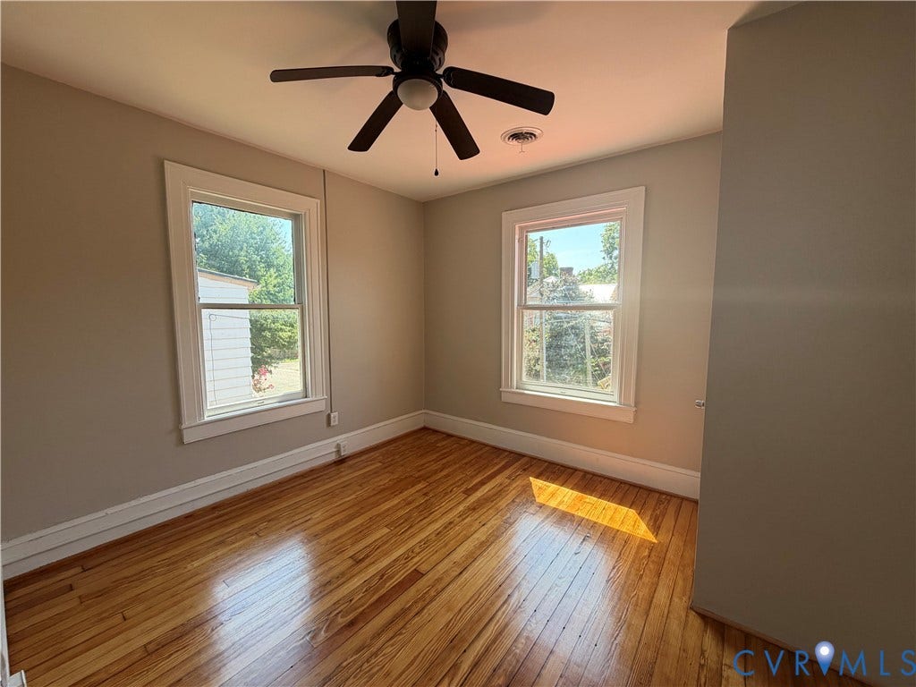 715 High Street, Petersburg, VA 23803 Wood-finish flooring with two windows and a ceiling fan