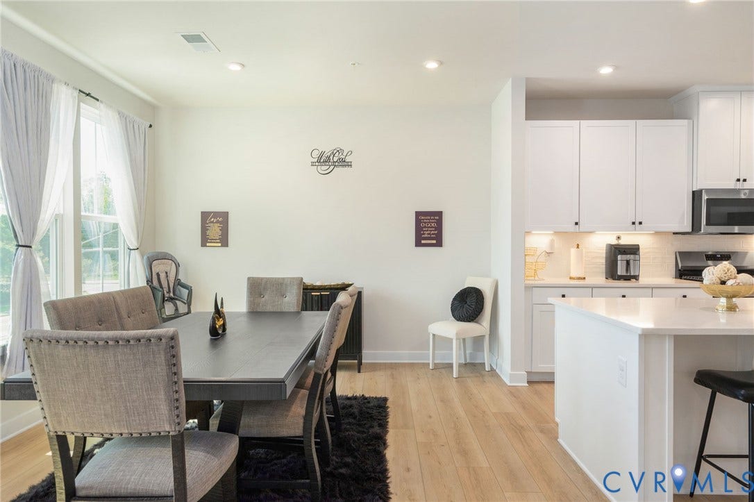 8045 Lake Laurel Lane, #B, Laurel Oak Condos, Glen Allen, VA 23060 Open-concept living space featuring wood-finish flooring, recessed lighting, and large windows