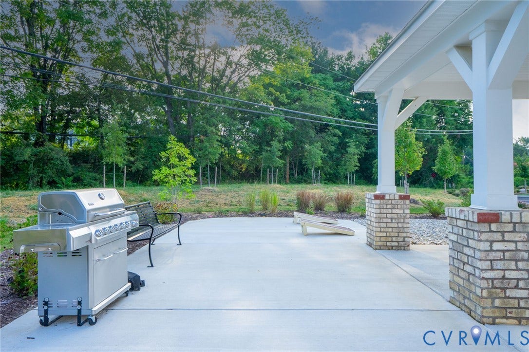 8045 Lake Laurel Lane, #B, Laurel Oak Condos, Glen Allen, VA 23060 Covered patio area with brick-clad columns and a concrete surface
