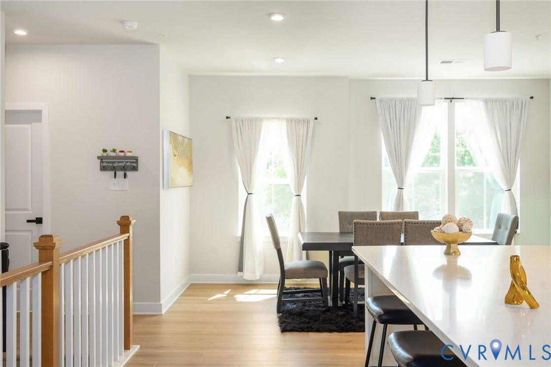 8045 Lake Laurel Lane, #B, Laurel Oak Condos, Glen Allen, VA 23060 Hardwood-finish flooring, white walls, recessed ceiling lighting, a white kitchen island, and modern pendant lighting