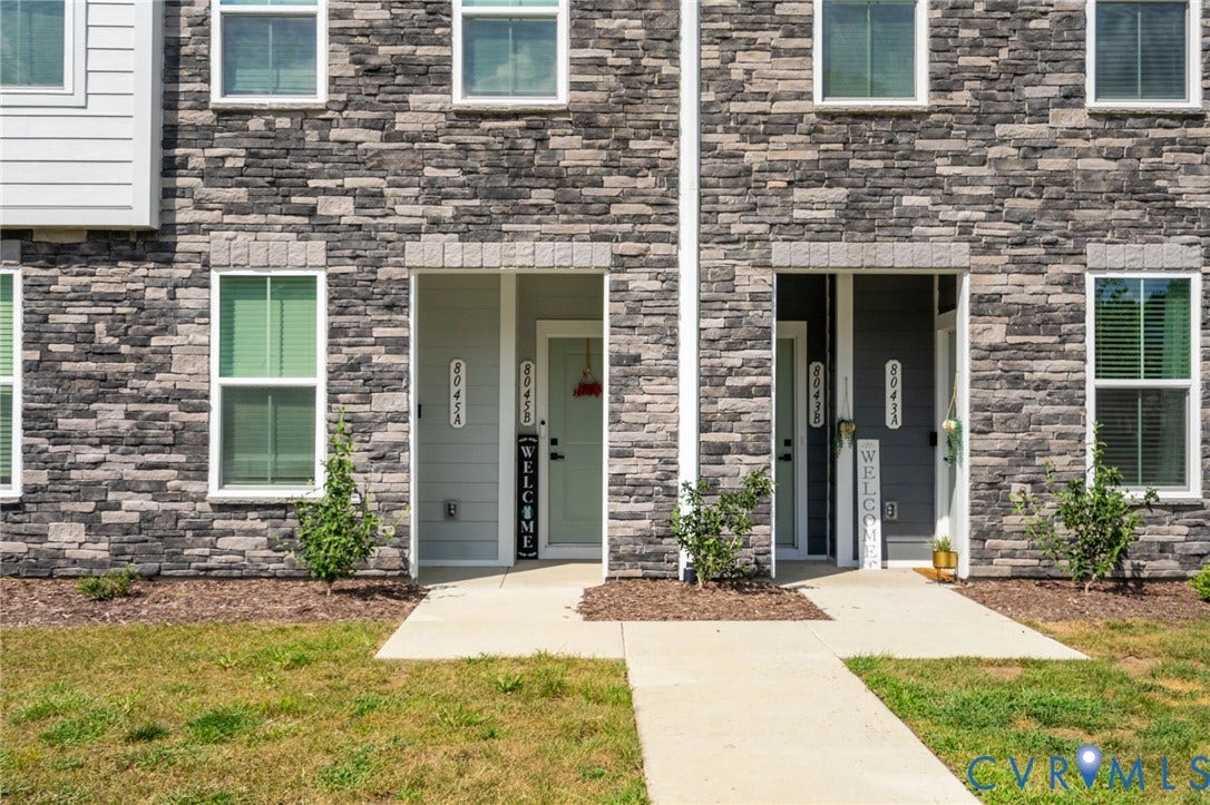 8045 Lake Laurel Lane, #B, Laurel Oak Condos, Glen Allen, VA 23060 Stacked stone exterior with white window frames and multiple entryways