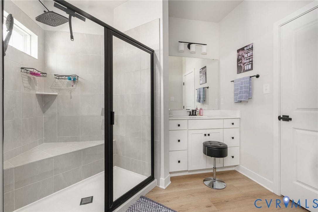 8045 Lake Laurel Lane, #B, Laurel Oak Condos, Glen Allen, VA 23060 Glass-enclosed shower with tiled bench seating, rain showerhead, and transom window