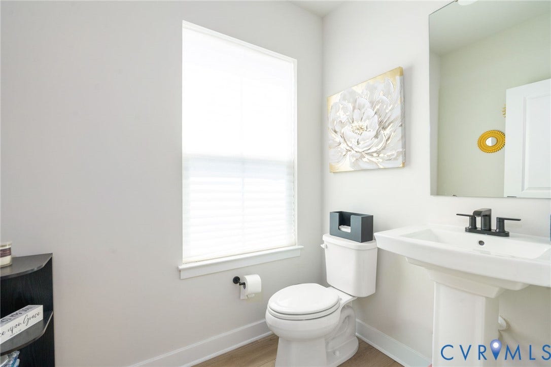 8045 Lake Laurel Lane, #B, Laurel Oak Condos, Glen Allen, VA 23060 Pedestal sink with black-finish faucet, toilet, and wood-finish flooring