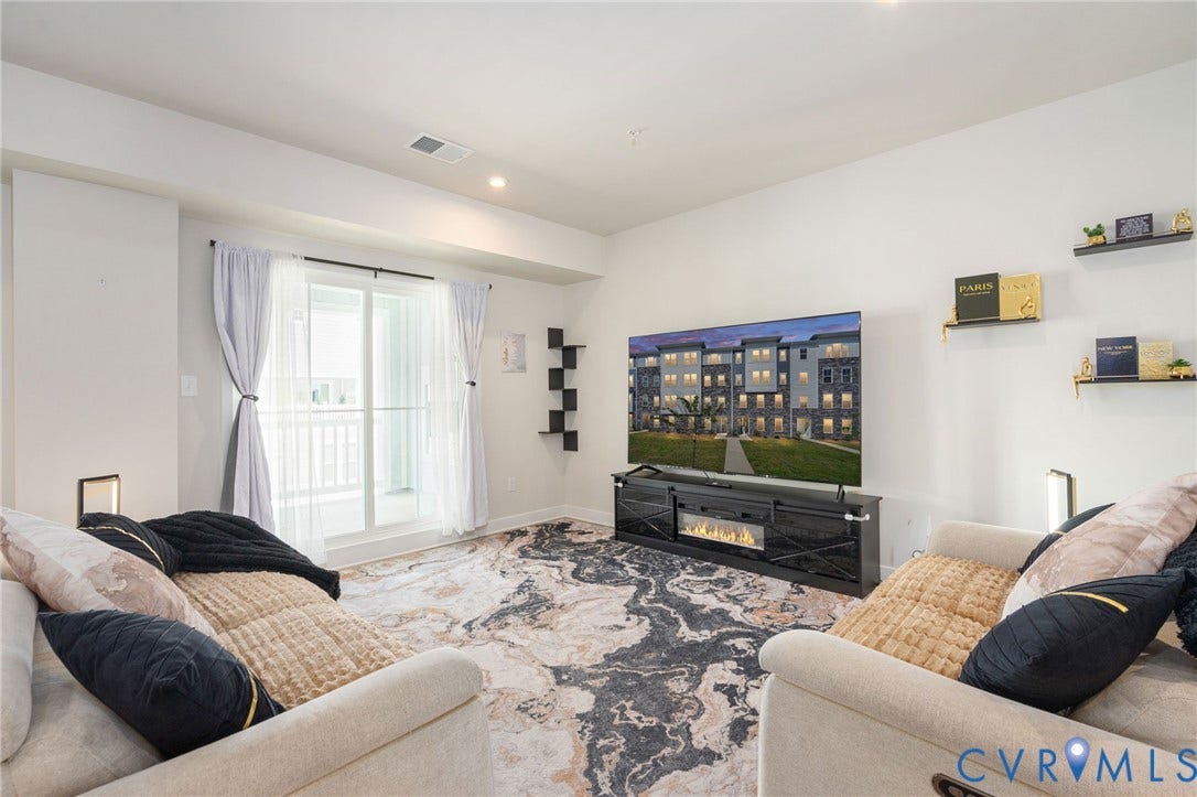 8045 Lake Laurel Lane, #B, Laurel Oak Condos, Glen Allen, VA 23060 Recessed lighting, sliding glass door, white walls, and a built-in media console with an electric fireplace