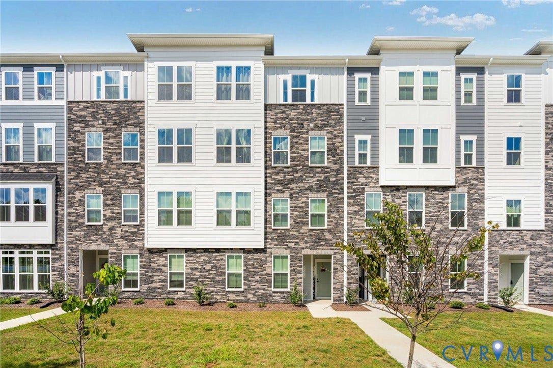 8045 Lake Laurel Lane, #B, Laurel Oak Condos, Glen Allen, VA 23060 Multi-level exterior featuring stone and siding finishes, multiple windows, and a paved walkway