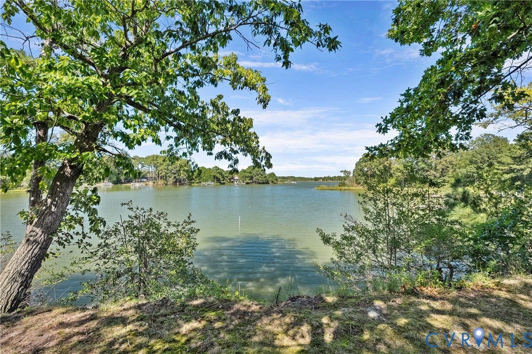 447 Tranquility Road, Reedville, VA 22539 Expansive waterfront property featuring a wide body of water and mature trees