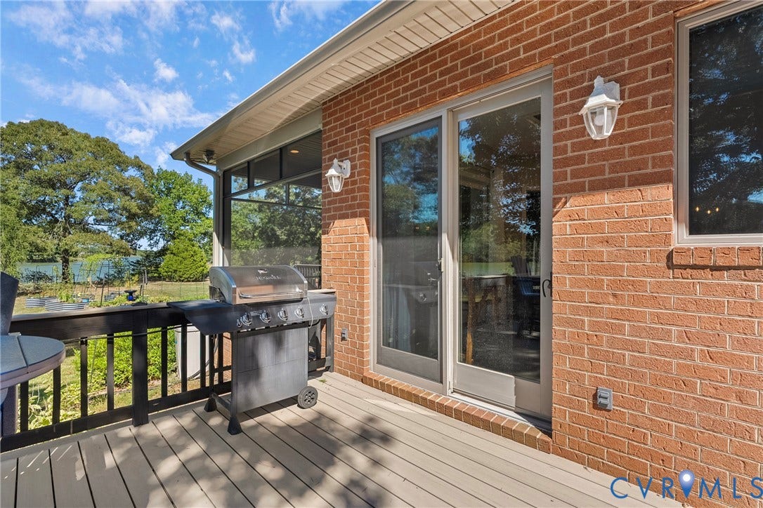 447 Tranquility Road, Reedville, VA 22539 Expansive outdoor deck featuring composite decking and a black railing system