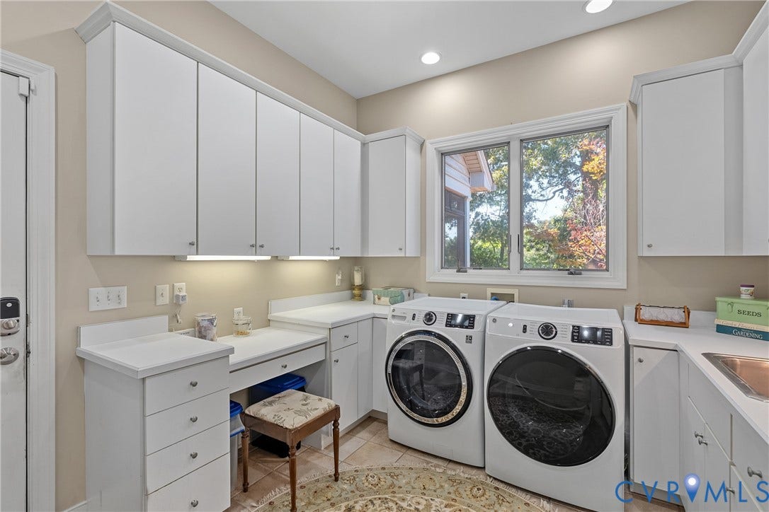 447 Tranquility Road, Reedville, VA 22539 White cabinetry and countertops with integrated sink