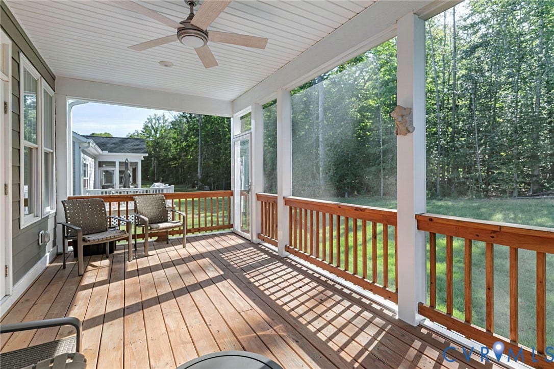 8681 Terroir Lane, Cottages At Viniterra, New Kent, VA 23124 Screened porch featuring a wood-finish floor, wood railings, and a ceiling fan
