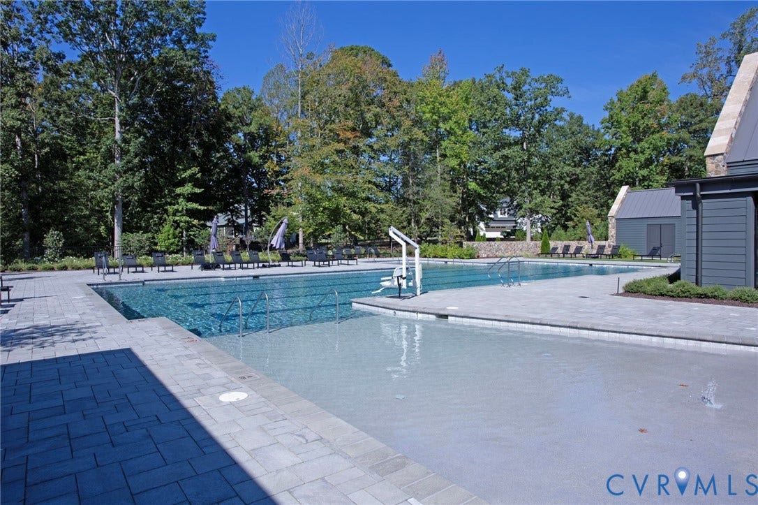 8681 Terroir Lane, Cottages At Viniterra, New Kent, VA 23124 Expansive swimming pool with integrated shallow area, surrounded by a paved patio