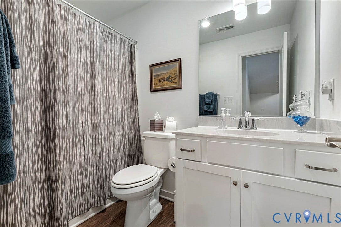 8681 Terroir Lane, Cottages At Viniterra, New Kent, VA 23124 White vanity with an integrated sink and chrome faucet
