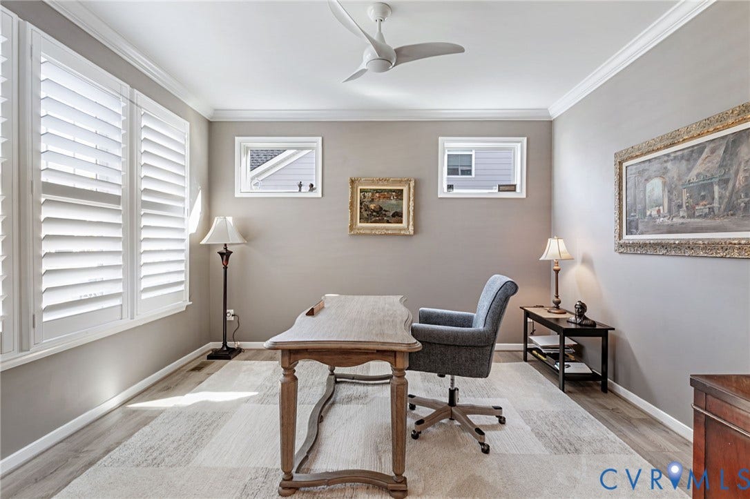 8681 Terroir Lane, Cottages At Viniterra, New Kent, VA 23124 Crown molding, LVP flooring, white window shutters, two transom windows, and a ceiling fan