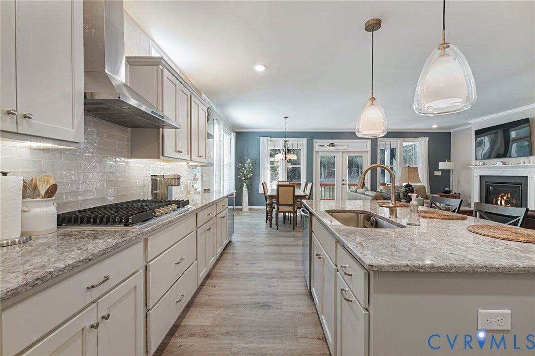 8681 Terroir Lane, Cottages At Viniterra, New Kent, VA 23124 Kitchen featuring light-gray cabinetry, stone countertops, a stainless steel range hood, a gas cooktop, and an undermount sink
