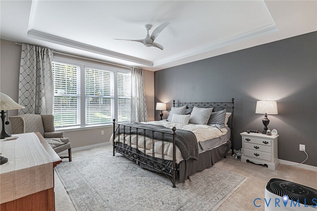 8681 Terroir Lane, Cottages At Viniterra, New Kent, VA 23124 Tray ceiling with crown molding, ceiling fan, and large window with blinds