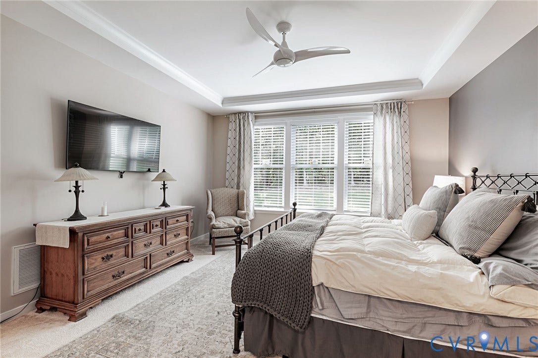 8681 Terroir Lane, Cottages At Viniterra, New Kent, VA 23124 Tray ceiling with crown molding, ceiling fan, and large windows with blinds