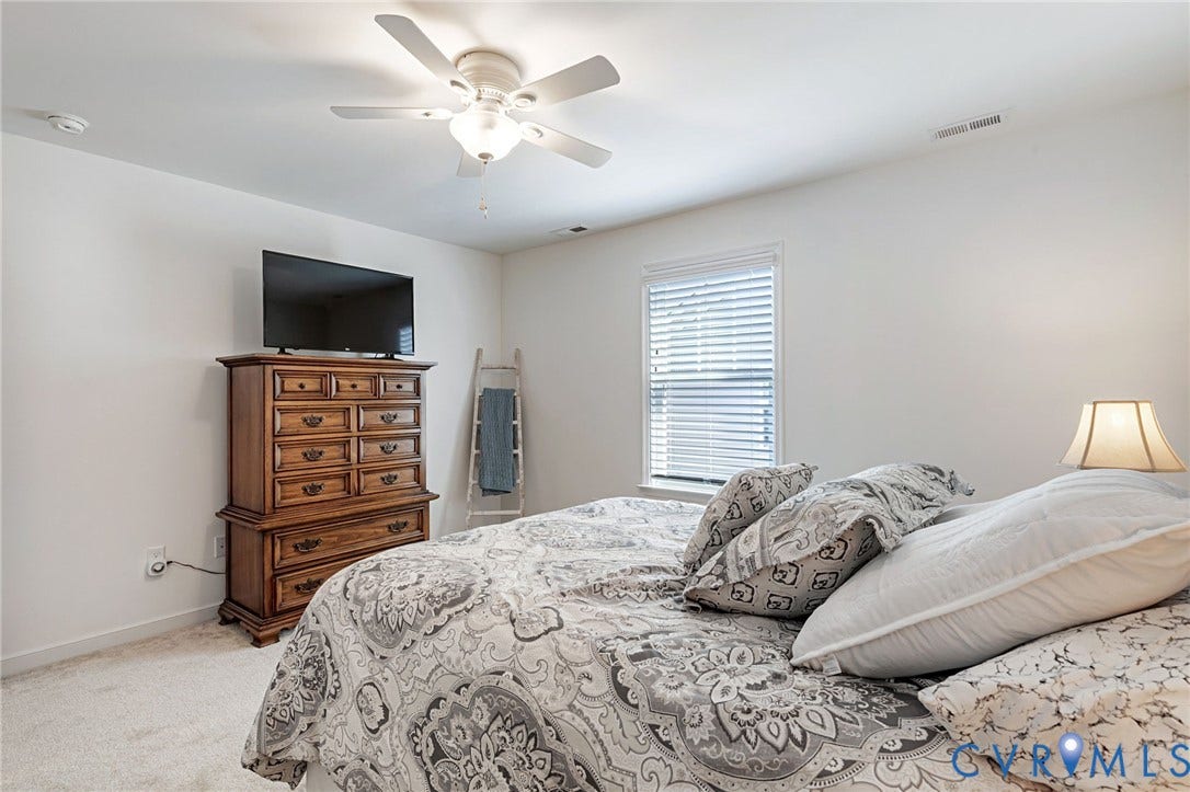 8681 Terroir Lane, Cottages At Viniterra, New Kent, VA 23124 Recessed lighting, ceiling fan light fixture, window with blinds, and light-toned carpet flooring