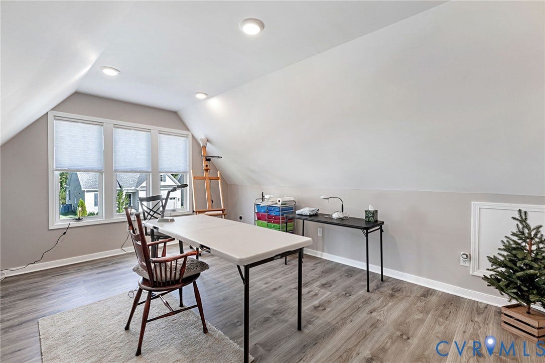 8681 Terroir Lane, Cottages At Viniterra, New Kent, VA 23124 Sloped ceilings with recessed lighting, triple window ensemble, wood-finish flooring, and white trim