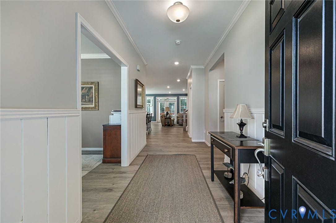 8681 Terroir Lane, Cottages At Viniterra, New Kent, VA 23124 Entryway featuring LVP flooring, wainscoting, crown molding, a paneled front door, and recessed lighting