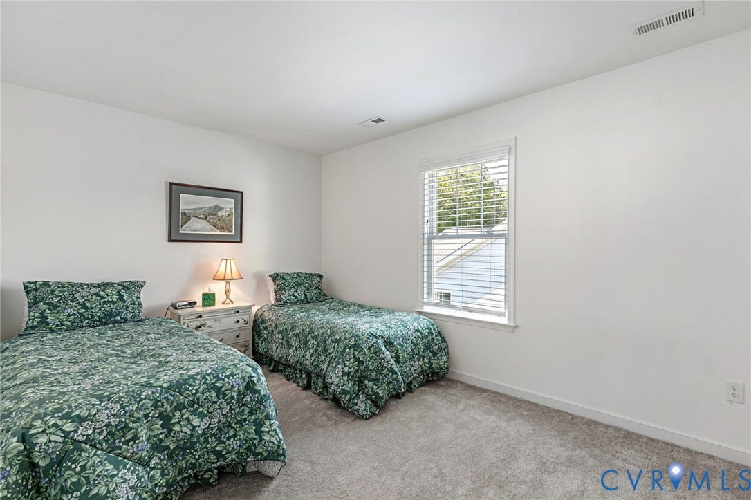8681 Terroir Lane, Cottages At Viniterra, New Kent, VA 23124 Bright interior wall paint, single window with blinds, and light-toned carpet flooring