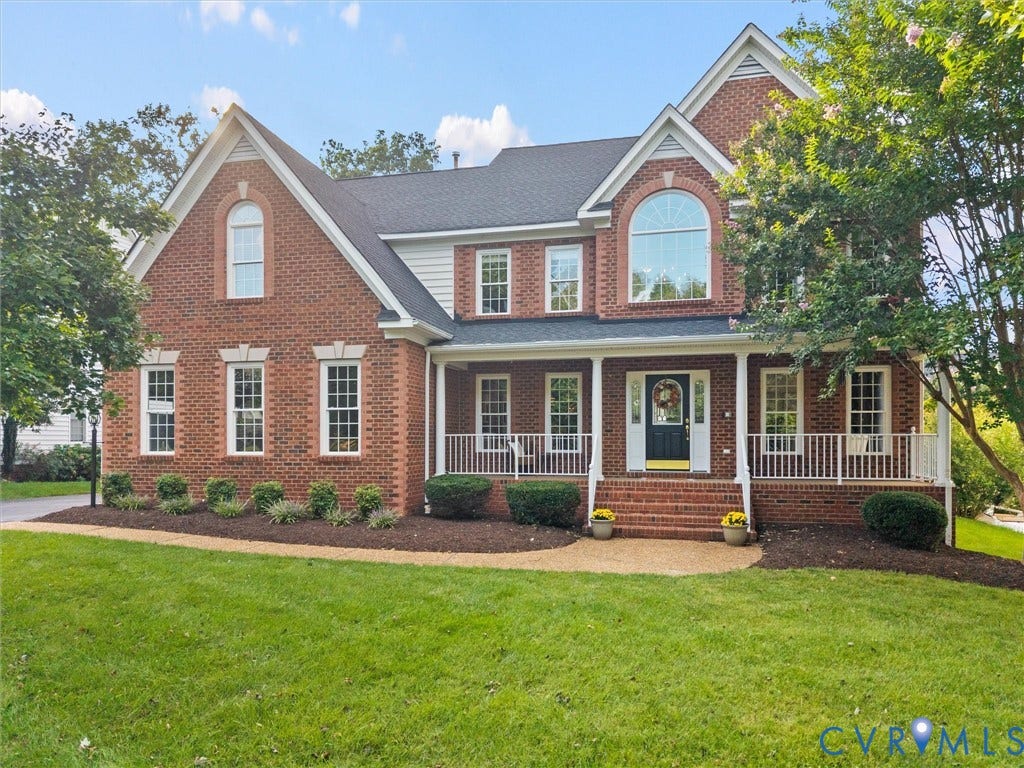 4616 Brookemere Drive, Glen Allen, VA 23060 Brick exterior with white trim, covered front porch, arched window, and mature landscaping